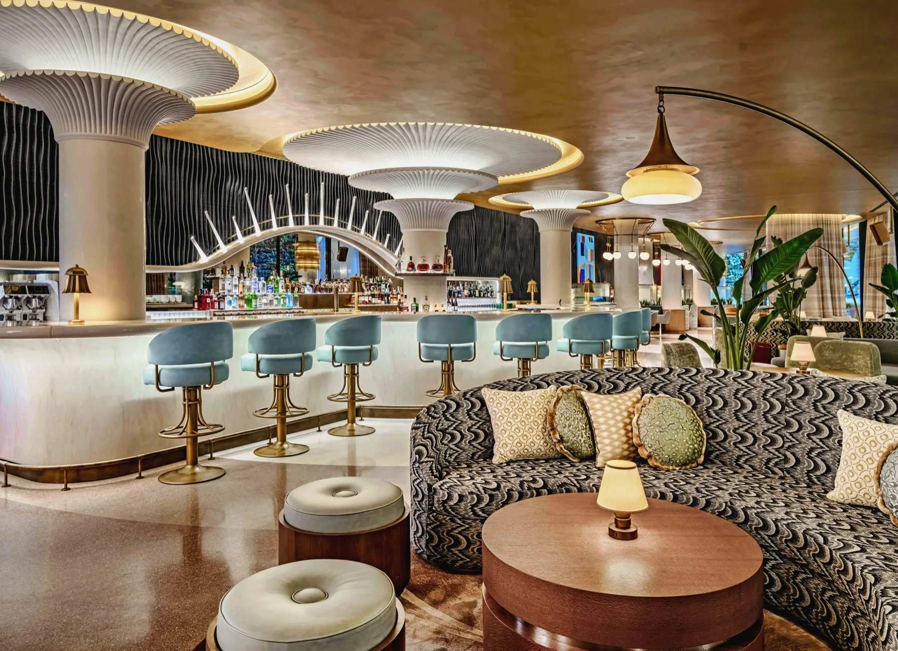 W Prague signature lounge — bar, velvet stools, sculpted ceiling